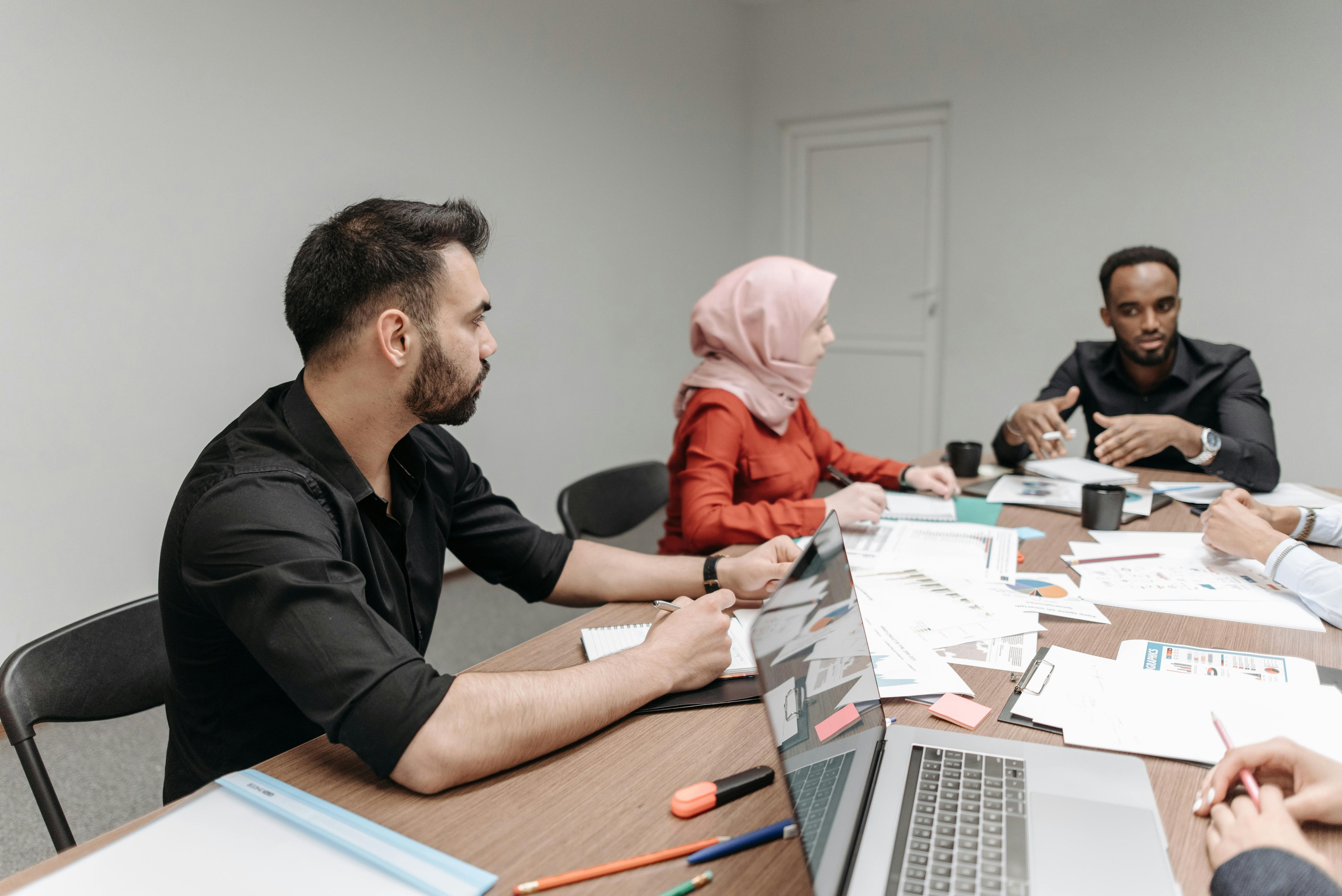 Diverse education team collaborating in a modern workplace